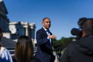“FBI agents outside a New York courthouse as Christopher Moynihan, a pardoned Capitol rioter, faces charges for threatening Congressman Hakeem Jeffries.”