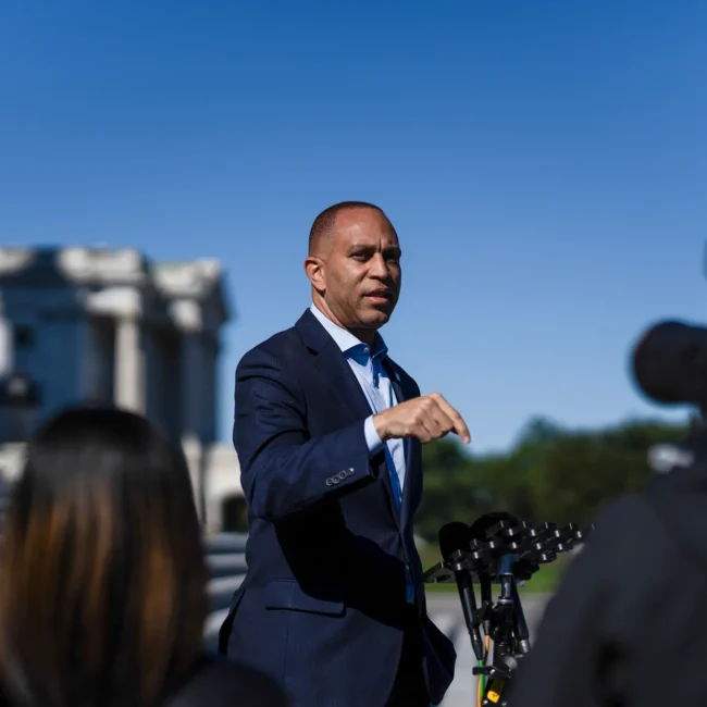 “FBI agents outside a New York courthouse as Christopher Moynihan, a pardoned Capitol rioter, faces charges for threatening Congressman Hakeem Jeffries.”