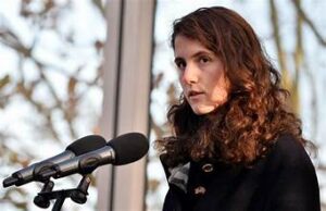 Portrait of Tatiana Schlossberg, JFK’s granddaughter, speaking at an environmental event