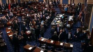 U.S. Senate chamber with a roll-call vote board showing 60-40, spotlighting eight Democrats who backed the funding measure.