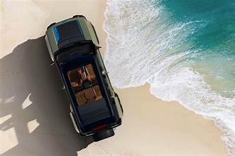 “Electric off-road SUV with open-air doors and adventure-ready stance”