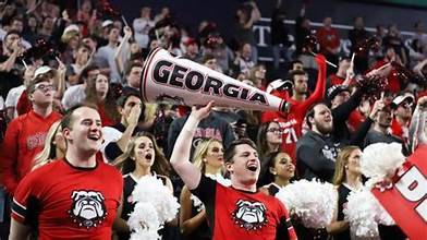 UGA fans cheering after a crucial defensive stop.