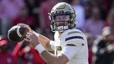 Georgia Tech quarterback preparing to throw under pressure.