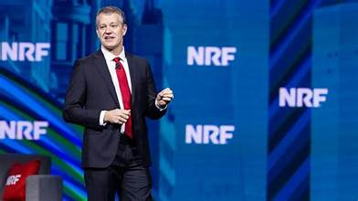 “John Furner speaking at a Walmart corporate event as the newly appointed CEO taking over in 2026.”