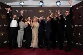 Golden Globe winners celebrating on stage at the 2026 awards ceremony